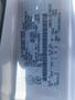 A 2009 Ford Econoline vehicle identification label with details including the make model and specifications