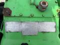 A green engine with visible branding for Gardner Denver and metal plates displaying specifications and information about the engine model and manufacturer