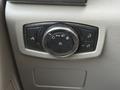 A control panel with various knobs and buttons for adjusting vehicle lights and features in a 2020 Ford F-550
