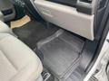 Interior view of a 2019 Ford F-150 showing the driver's side floor with a rubber mat and fabric seat upholstery