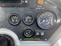 Dashboard controls of a 2015 Global Street Sweeper featuring various gauges for engine temperature oil pressure and RPM with labels including a warning to start engine functions