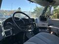 Interior view of a 2007 International 7300 truck with a steering wheel dashboard and controls for various functions