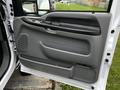The image shows the interior door panel of a 2007 Ford F-550 featuring a gray plastic design and several controls for windows and locks
