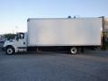 A 2014 International Durastar truck with a large white cargo box and dual rear wheels parked on a concrete surface