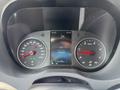 Dashboard of a 2019 Mercedes-Benz Sprinter showing speedometer and tachometer with a digital display indicating temperature and mileage