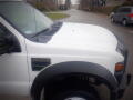 2008 Ford F-550 with a white exterior view showing the hood and fender area with the F-550 badge