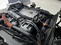 An exposed engine of a 2007 GMC W3500 with various metal components and hoses visible
