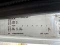 Label showing specifications for a 2011 International 4300 including weight ratings and vehicle identification number