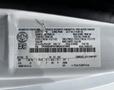 A 2021 Ford E-450 vehicle identification label showing specifications such as weight and tire information