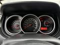 Dashboard of a 2012 Nissan Versa featuring speedometer tachometer fuel gauge and warning lights