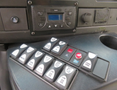 A panel of buttons and controls from a 2020 Chevrolet Express featuring various switches for vehicle functions and settings