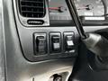 Controls and buttons on the dashboard of a 2003 Mitsubishi Delica including A/T mode and auto step features
