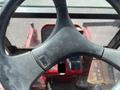 Steering wheel of a 2014 Toro Groundmaster 5910 with controls and dashboard visible in the operator's compartment
