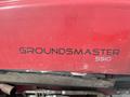 A red 2012 Toro Groundsmaster 5910 with the model name prominently displayed in black text