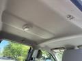 Interior view of the ceiling of a 2017 Ford F-350 SD showing light fixtures and upholstery details