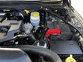 The image shows the engine compartment of a 2022 RAM 3500 with visible components including the coolant reservoir battery and various hoses and connections