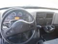 Interior view of a 2014 International Durastar featuring a steering wheel dashboard gauges audio system and center console