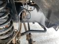 A close-up view of the suspension system components of a 2015 Ford F-550 including springs and metal brackets