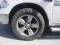 A close-up view of a silver alloy wheel and tire on a 2019 RAM 1500 Classic Eco Diesel showcasing rugged tread and a shiny surface