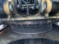 Close-up view of the rotating section of a 2014 John Deere 350G machinery with visible hydraulic hoses and signs of wear and rust