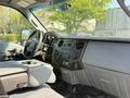 Interior view of a 2015 Ford F-550 featuring a modern dashboard with controls and a console seat