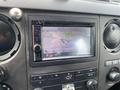 A 2015 Ford F-550 dashboard display showing a navigation screen with a map and various control buttons
