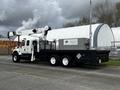 A 2008 International 7500 truck with a utility crane mounted on the cab and a large storage box in the bed