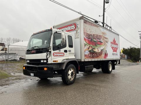 A 2006 GMC F7B042 box truck featuring a Dempster's advertisement showcasing sandwiches on the side