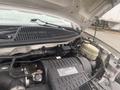 Close-up of the engine compartment of a 2017 Chevrolet Express showcasing the Vortec engine with various components and wiring visible