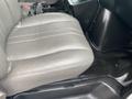 A gray leather seat from a 2014 Chevrolet Express with a sleek design and stitching details