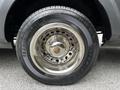 A close-up of a chrome alloy wheel on a 2017 Ford Transit 350 featuring a black tire with tread patterns and the name TRANSFORCE GV visible on the sidewall