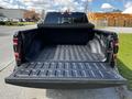 A 2019 RAM 1500 truck with an open bed revealing a lined cargo area designed for hauling and transporting items
