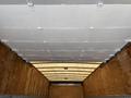 Interior view of a 2015 Freightliner M2 106 cargo truck showing the ceiling and walls with metal fasteners and wooden flooring