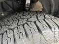 Close-up of a tire tread on a 2023 Ford Transit showcasing intricate patterns designed for traction and grip