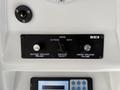 Control panel of a 2018 Grande West Vicinity featuring dials for inside and outside speaker volume and a switch for speaker selection