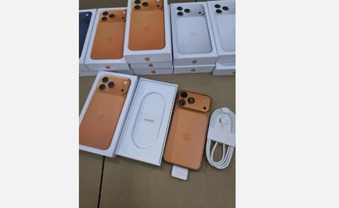A collection of Apple iPhones including a used iPhone 17 Pro Max and iPhone 16 Pro Max, displayed with their boxes and accessories