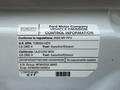 A label on a 2022 Ford Transit detailing vehicle emission control information and compliance regulations