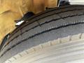 Close-up of a treaded tire from a 2006 Hino 268 showing deep grooves and wear patterns