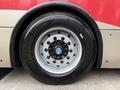 Close-up of the wheel of a 2016 Grande West Vicinity bus featuring a silver rim with multiple bolts and a black tire with the brand name Sailun written on it