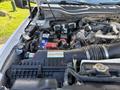 2020 Ford F-550 engine with visible components including the battery and various hoses and wires