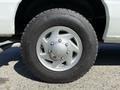 A close-up of a silver alloy wheel with a Goodyear tire on a 2011 Ford Econoline