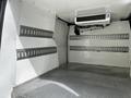 A 2019 Ford Transit Connect interior with metal shelving and a ventilation unit on the ceiling
