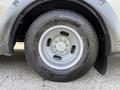 Close-up of a wheel and tire on a 2020 Chevrolet Express showing a silver alloy rim and a Bridgestone Blizzak tire mounted on it