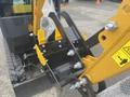 A close-up view of the hydraulic arm and bucket attachment on a 2024 AGT Industrial H13R Mini Excavator