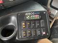 Control panel of a 2012 Chevrolet Express with various switches and indicator lights including those for interior light and ramp voltage