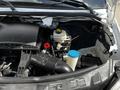 The image shows the open hood of a 2012 Mercedes-Benz Sprinter revealing its engine components including an air intake system and fluid reservoir