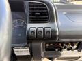 Dashboard controls of a 2007 GMC W5500 18 foot cube van featuring buttons for cruise control and air conditioning