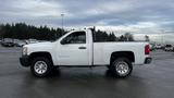 A white 2013 Chevrolet Silverado 1500 pickup truck with a single cab and chrome wheels parked on a surface