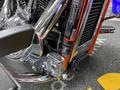 A close-up of the chrome and black engine components of a 2024 Harley Davidson Fat Boy showcasing intricate detailing and polished finishes