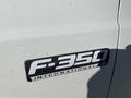 Close-up of a 2000 Ford F-350 SD badge displaying the model name and the word International